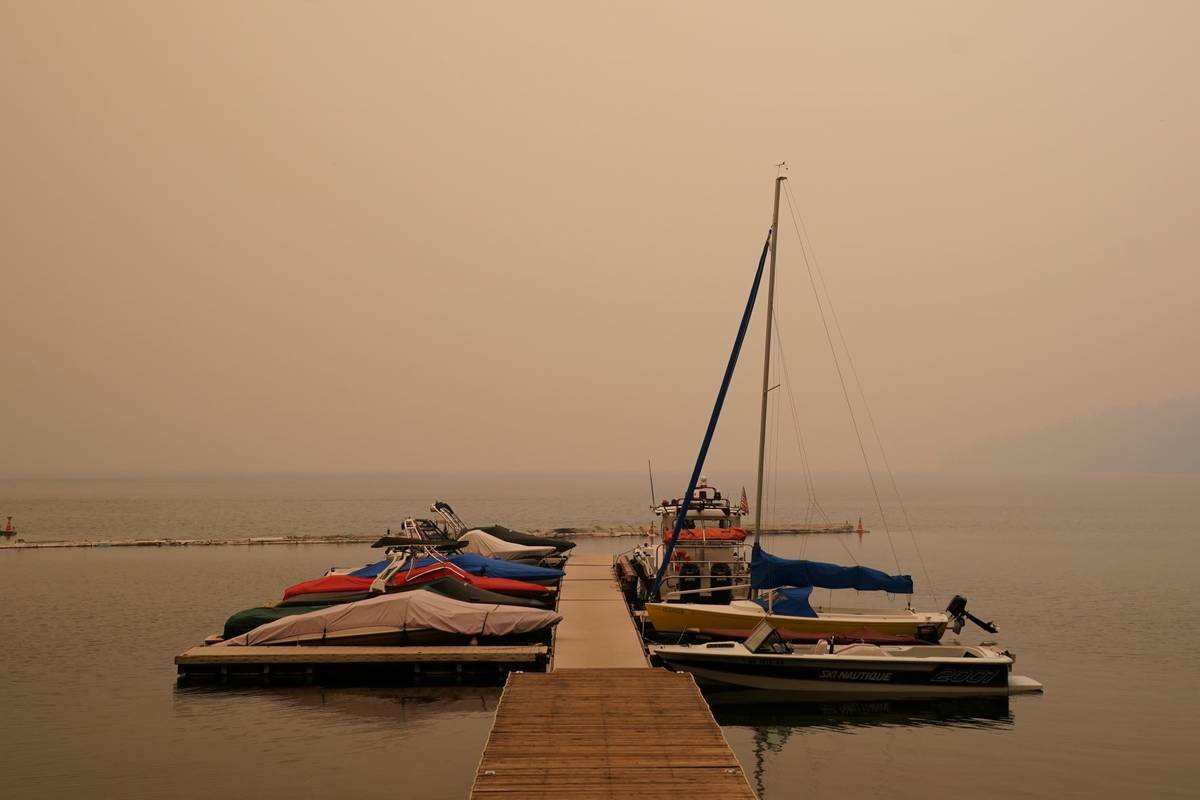 Smoke from the Caldor Fire, shrouds Fallen Leaf Lake near South Lake Tahoe, Calif., Tuesday, Au ...