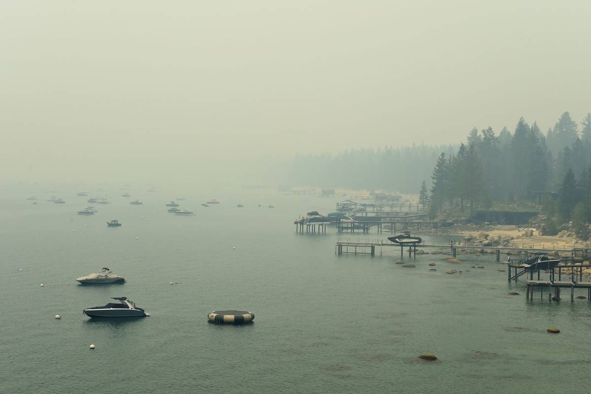 Smoke from Caldor Fire in California covers Lake Tahoe in the Incline, Nev., area on Tuesday, A ...