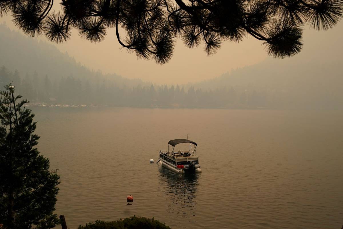 Smoke from the Caldor Fire, shrouds Fallen Leaf Lake near South Lake Tahoe, Calif., Tuesday, Au ...