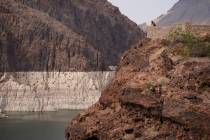 In this Aug. 13, 2021, file photo, a person looks out over Lake Mead near Hoover Dam at the Lak ...