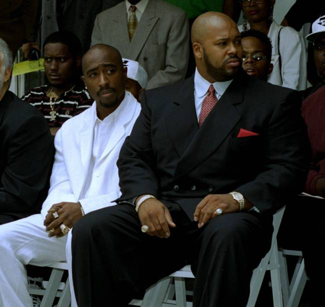 Rapper Tupac Shakur, left, and Death Row Records chair Suge Knight attend a voter registration ...