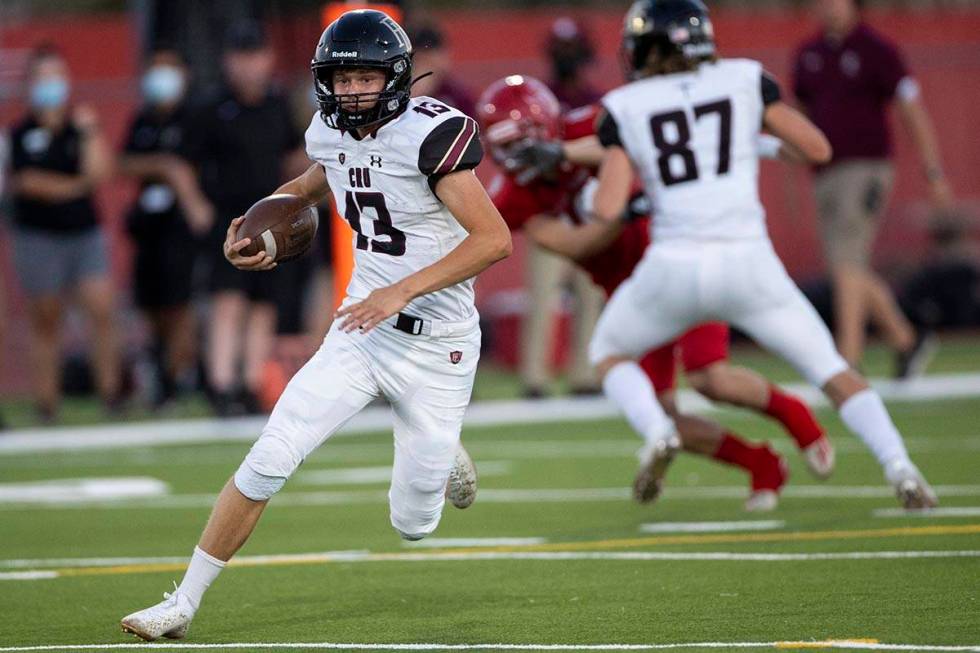 Faith Lutheran's Rylan Walter (13) runs the ball during the first quarter of football game agai ...