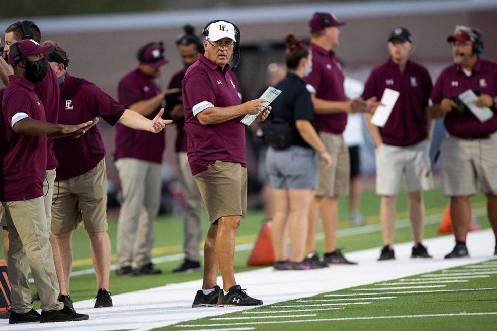 Faith Lutheran's head coach Mike Sandford watches his team play Arbor View during the first hal ...