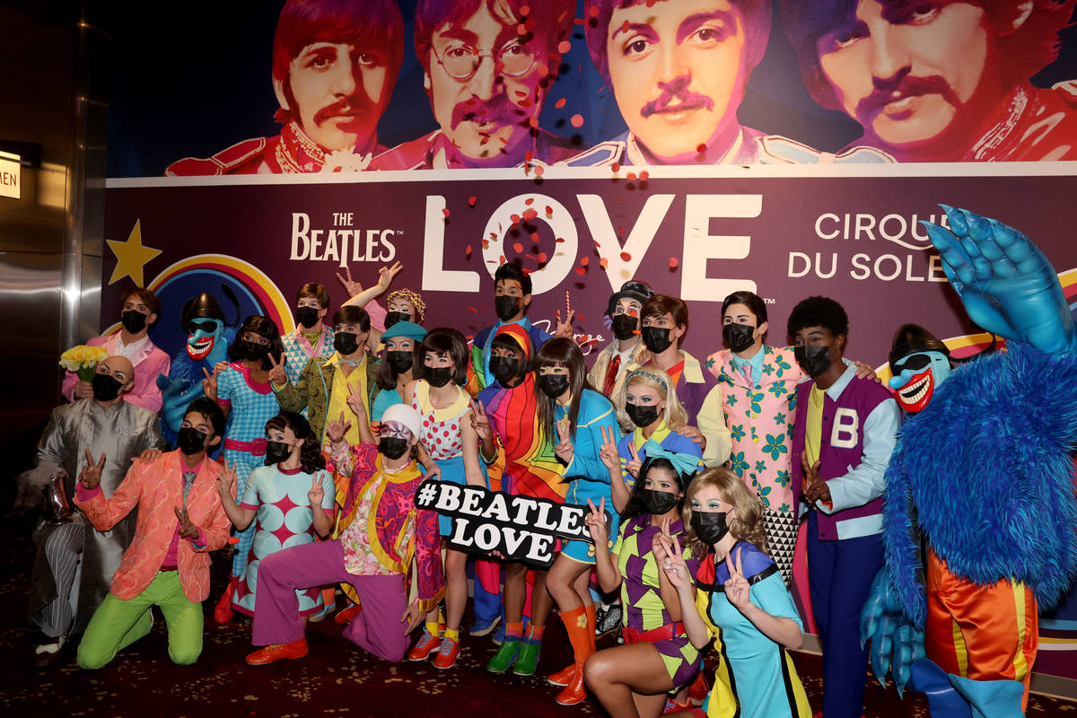 The cast of The Beatles LOVE entertain guests, employees, and fans during a celebratory pop-up ...