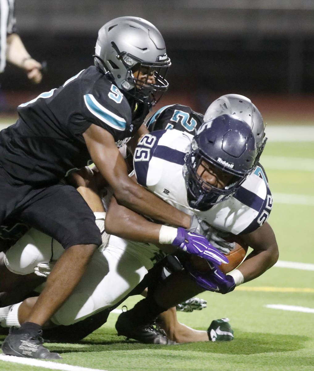 Shadow Ridge High School's Jaquieze Holland (25) plays against Silverado High School's Jaden Th ...