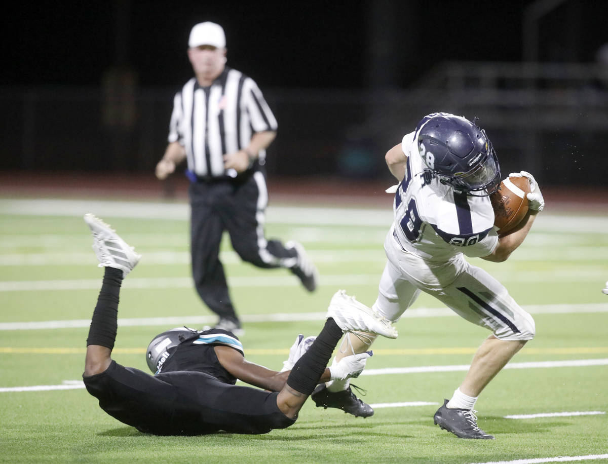 Shadow Ridge High School's Dylan Wood (28) keeps a ball away from Silverado High School's Shyn ...