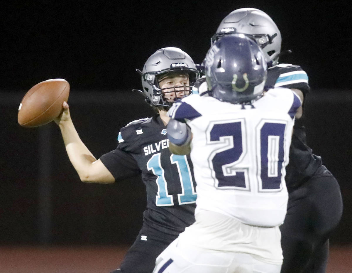 Silverado High School quarterback Brandon Tunnell (11) throws a pass during the second half of ...