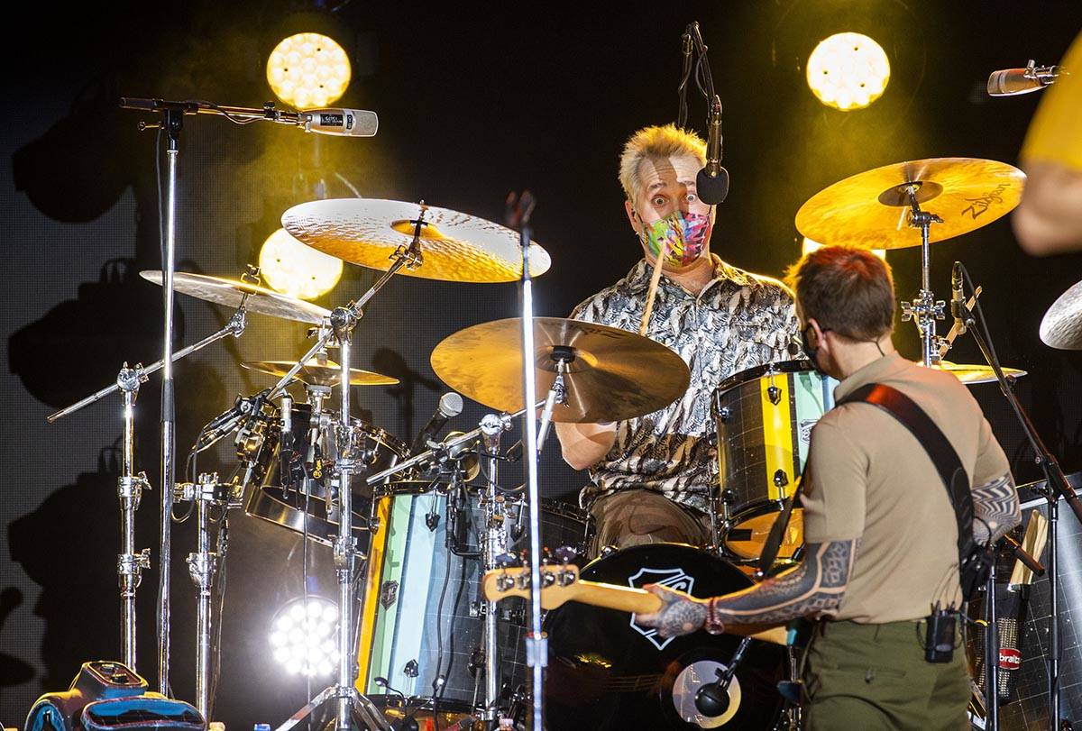 Imagine Dragons drummer Daniel Platzman, center, plays with bass guitarist Ben McKee as the ban ...