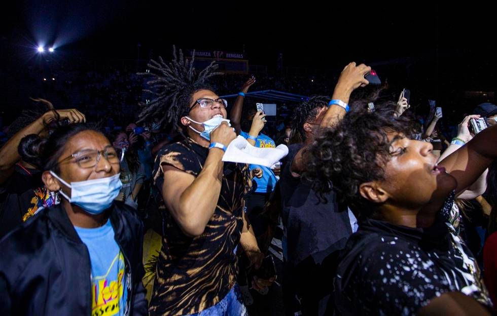 Students dance and sing along as the Imagine Dragons perform at a Walmart-sponsored "Homecoming ...