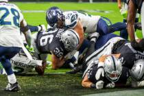 Raiders running back Trey Ragas (36) scores the first touchdown as Seattle Seahawks linebacker ...