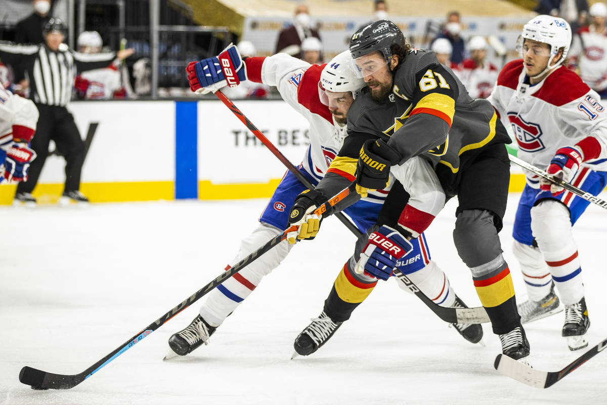 Golden Knights right wing Mark Stone (61) battles for control of the puck with Montreal Canadie ...