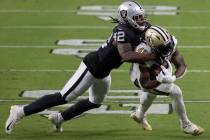 Las Vegas Raiders inside linebacker Cory Littleton (42) tackles New Orleans Saints running back ...