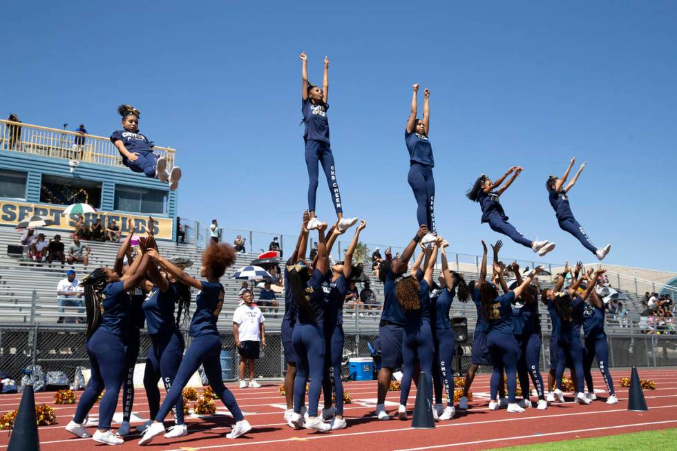 Cheyenne cheerleaders perform stunts during a football game against Clark High School at Cheyen ...