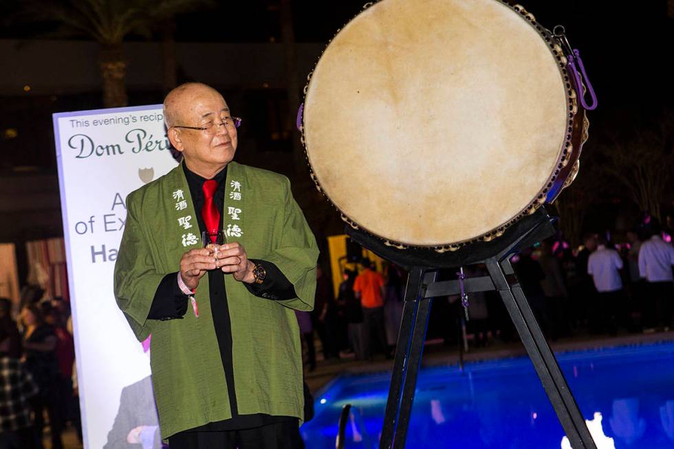 Honoree Hae Un Lee, a.k.a. Mr. Lee, looks on while participating in a sake barrel ceremony duri ...