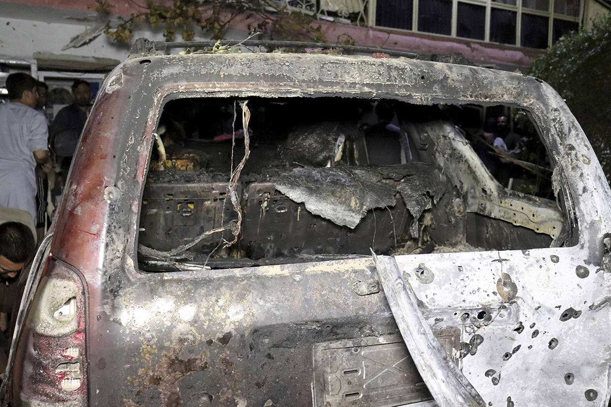 A destroyed vehicle is seen inside a house after a U.S. drone strike in Kabul, Afghanistan, Sun ...