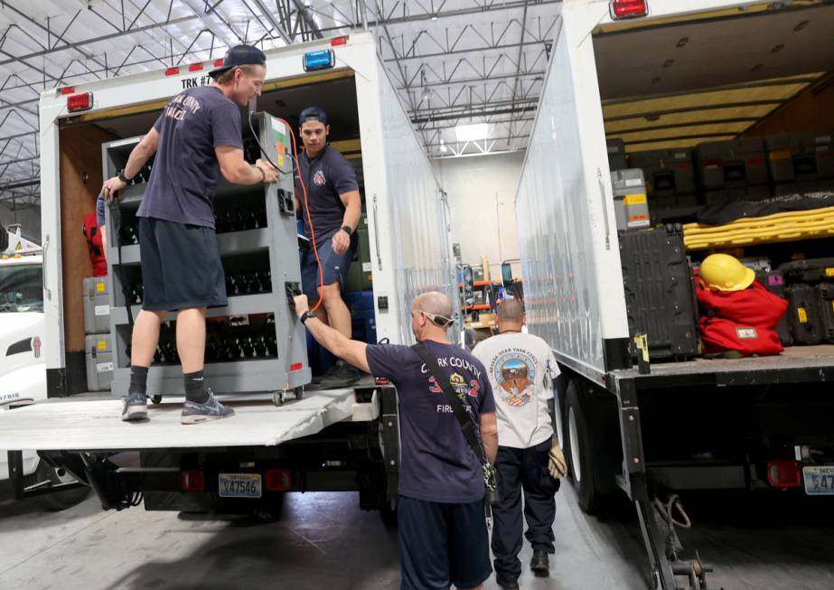 Members of the FEMA Nevada Task Force 1 Urban Search & Rescue team, including from left, Ad ...