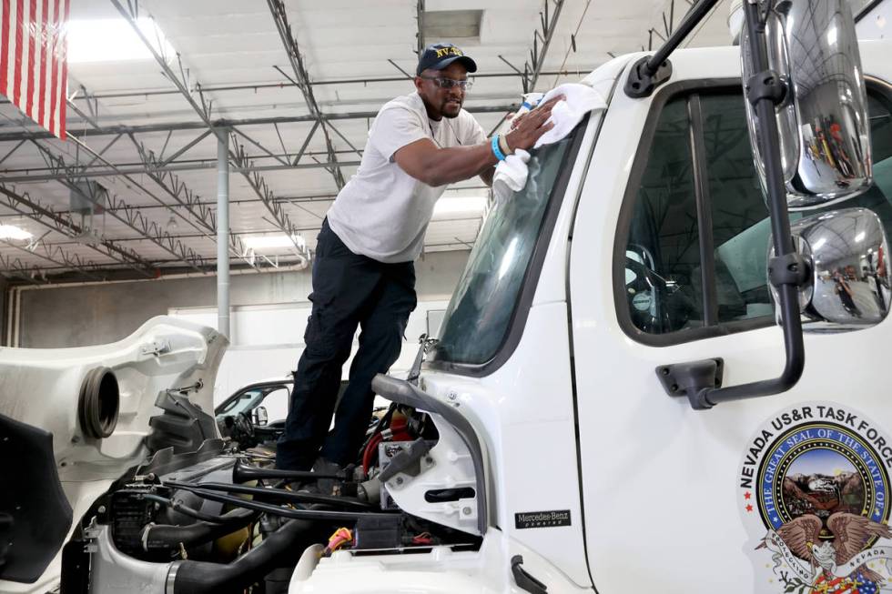 Members of the FEMA Nevada Task Force 1 Urban Search & Rescue team, including Dexter Willif ...