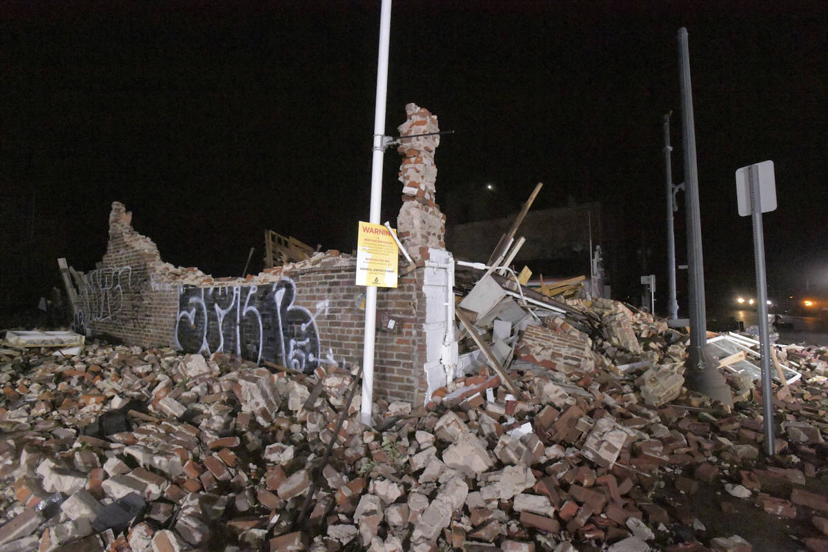 A collapsed historical building is seen on S. Rampart St. in New Orleans, La., early Monday, Au ...