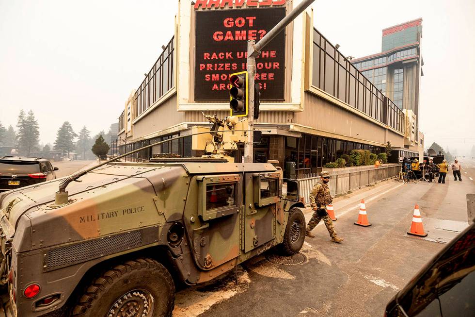 National Guardsmen staff a checkpoint in South Lake Tahoe, Calif., on Tuesday, Aug. 31, 2021, A ...
