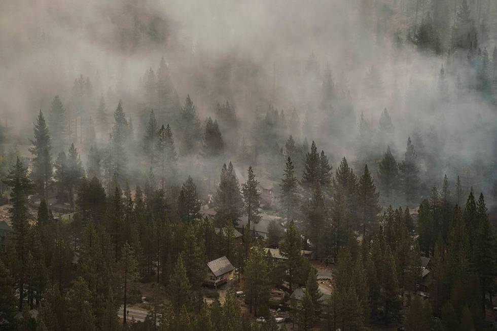 Smoke generated by the Caldor Fire fills the air in the Christmas Valley neighborhood of South ...