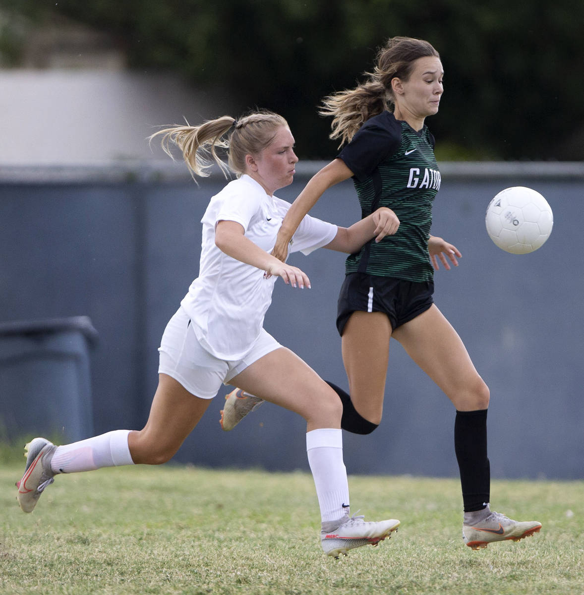 Foothill's Morgan Huff (18) catches up with Green Valley's Riley Cardenas (1) during their high ...