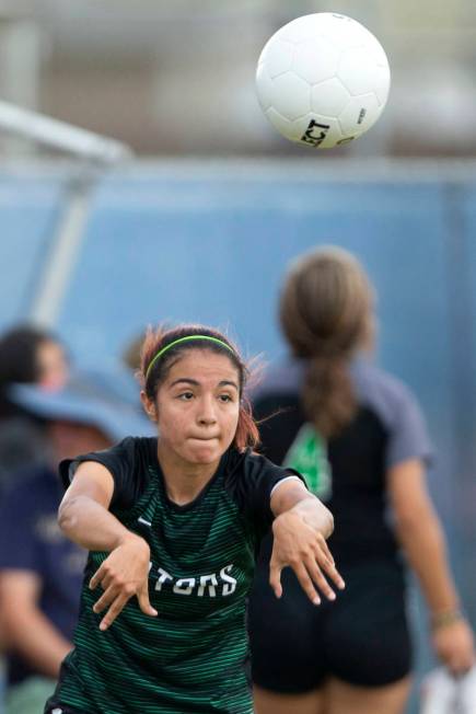 Green Valley's Angelique Ruiz-Salazar (8) throws in during her high school soccer game against ...