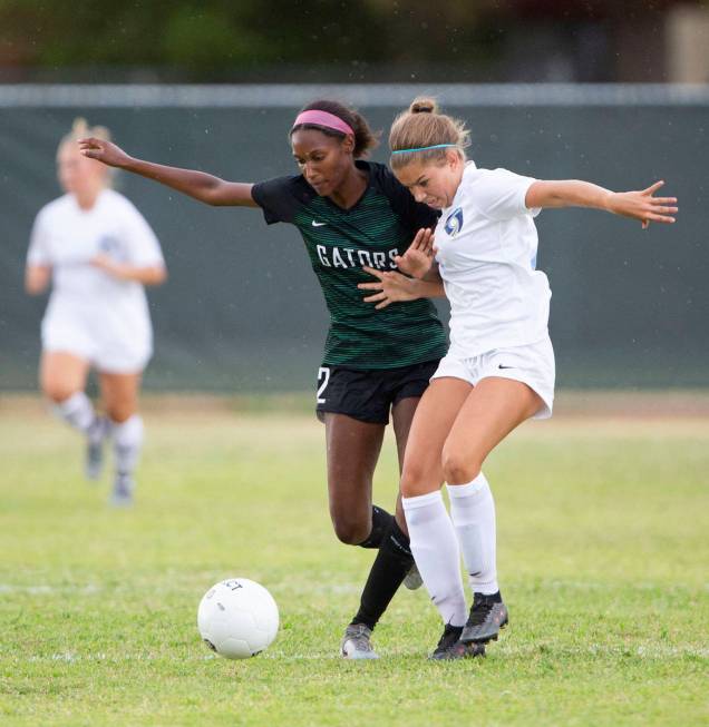 Green Valley's Sage Reed (2) and Foothill's Isabelle Simoneau (16) compete for the ball during ...