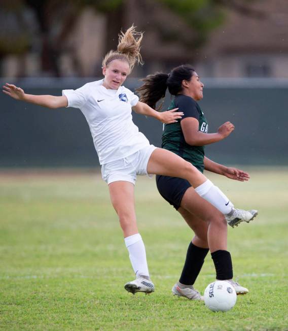 Foothill's Emma Rietz (9) falls back after colliding with Green Valley's Thalia Monreal (19) du ...
