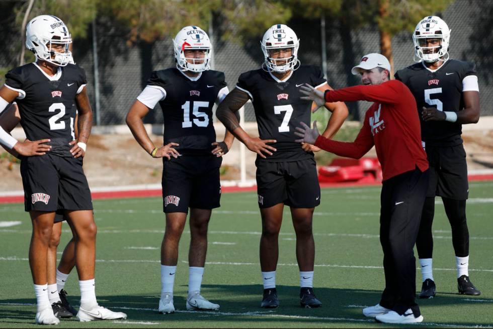 UNLV Rebels quarterbacks Doug Brumfield (2), Matthew Geeting (15), Cameron Friel (7), Justin Ro ...