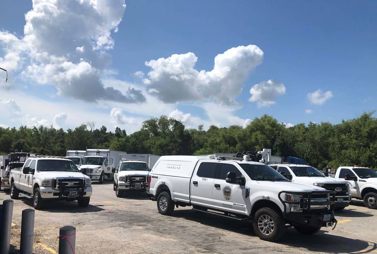 Convoy vehicles of the Nevada Task Force 1 Urban Search and Rescue team line up for fue ...