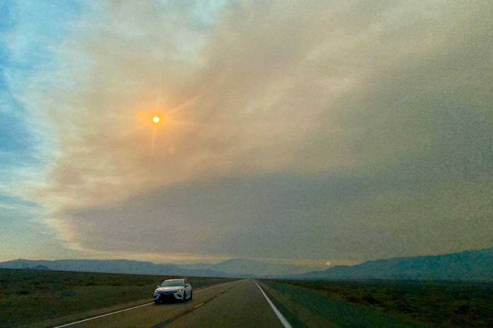 Smoke and clouds dominate the skies Tuesday, Aug. 31, 2021, on U.S. Highway 95 near Hawthorne. ...