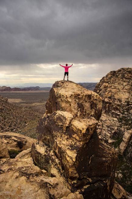 52 Peaks leader Bruce Small celebrates after completing a hike at Red Rock Canyon on Wednesday, ...