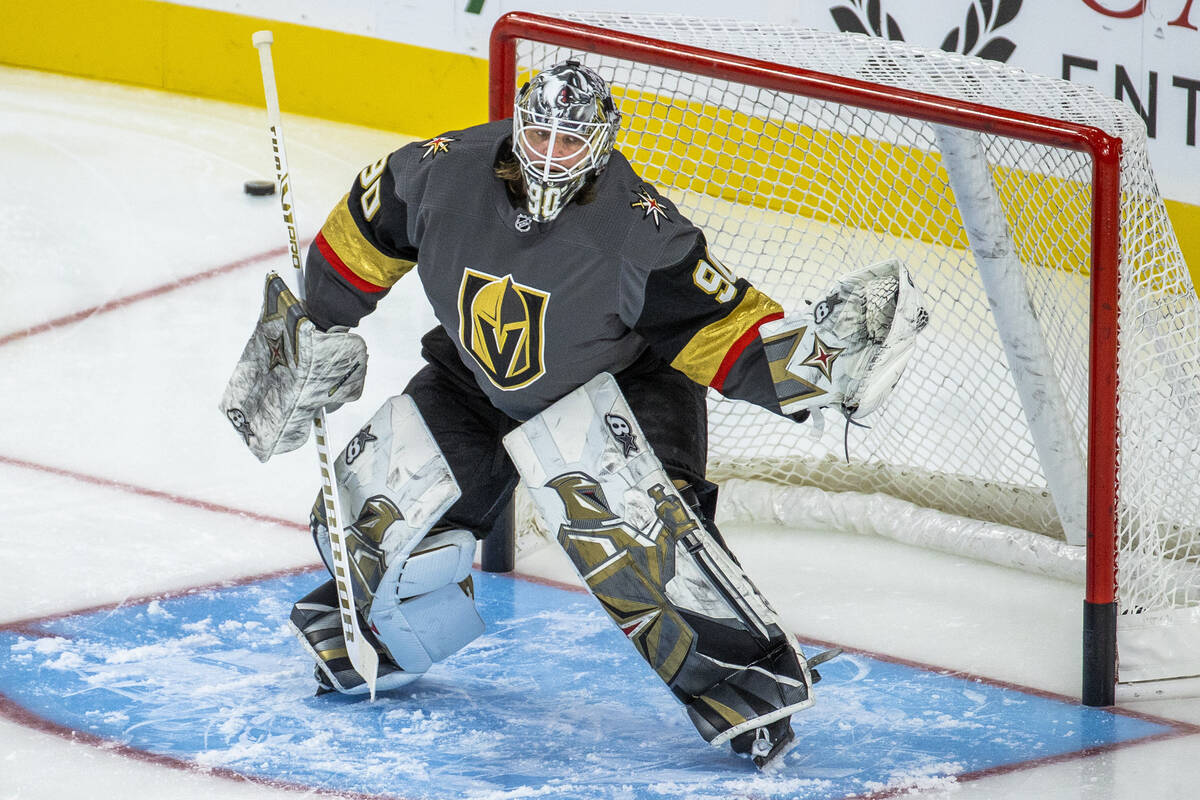 Golden Knights goaltender Robin Lehner (90) stops a puck from a teammate during the warm ups of ...