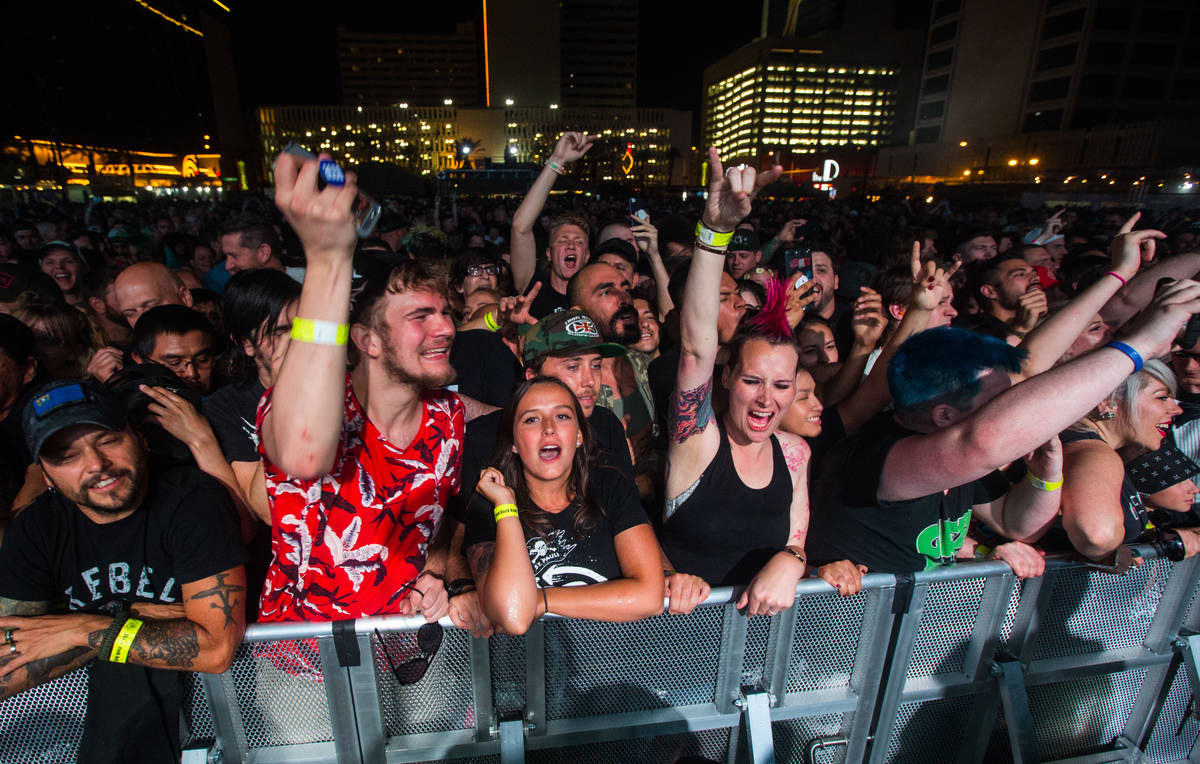 Attendees react as Rise Against performs during the first day of the Punk Rock Bowling music fe ...