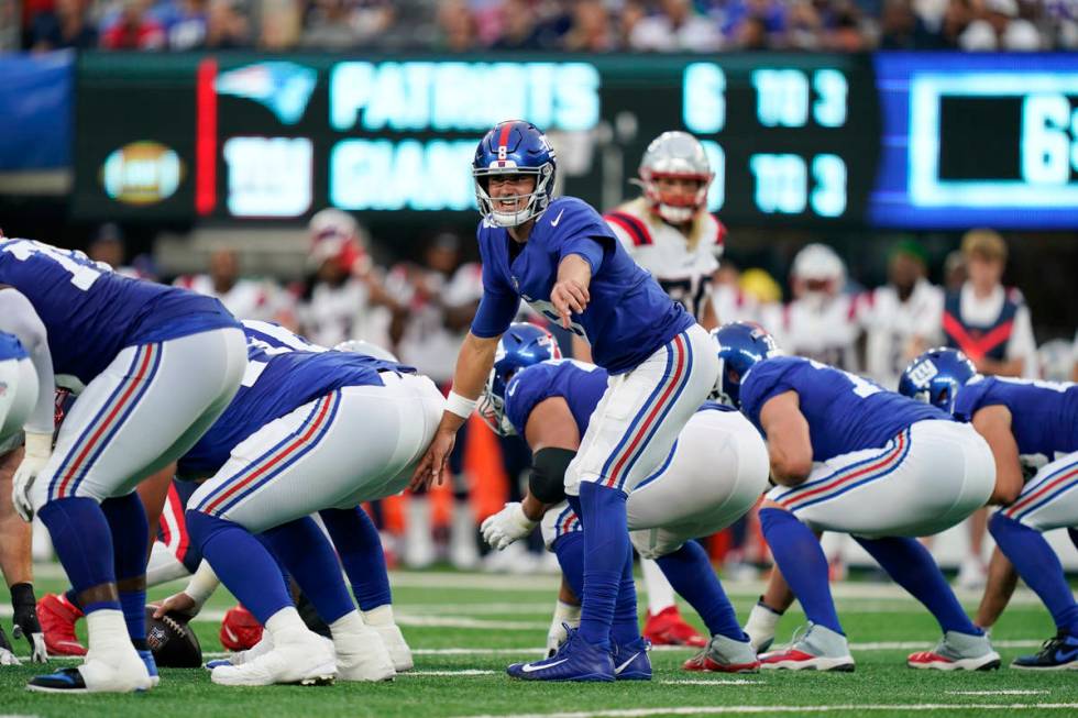 New York Giants quarterback Daniel Jones calls out to his team during the first half of an NFL ...