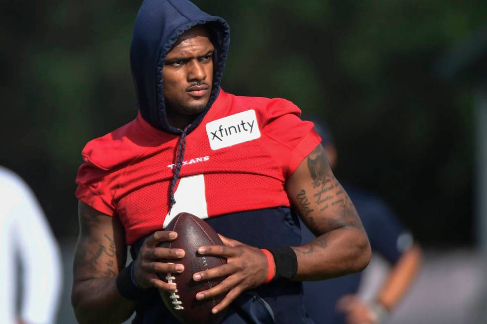 FILE- In an Aug. 2, 2021 file photo, Texans quarterback Deshaun Watson practices with the team ...