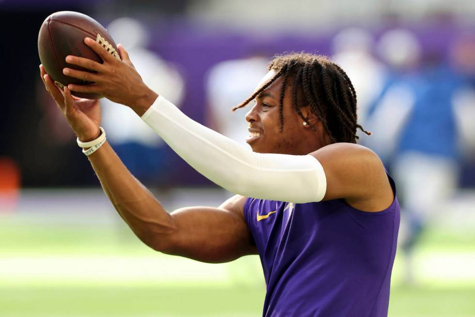 Minnesota Vikings wide receiver Justin Jefferson (18) catches a pass during pregame warmups pri ...