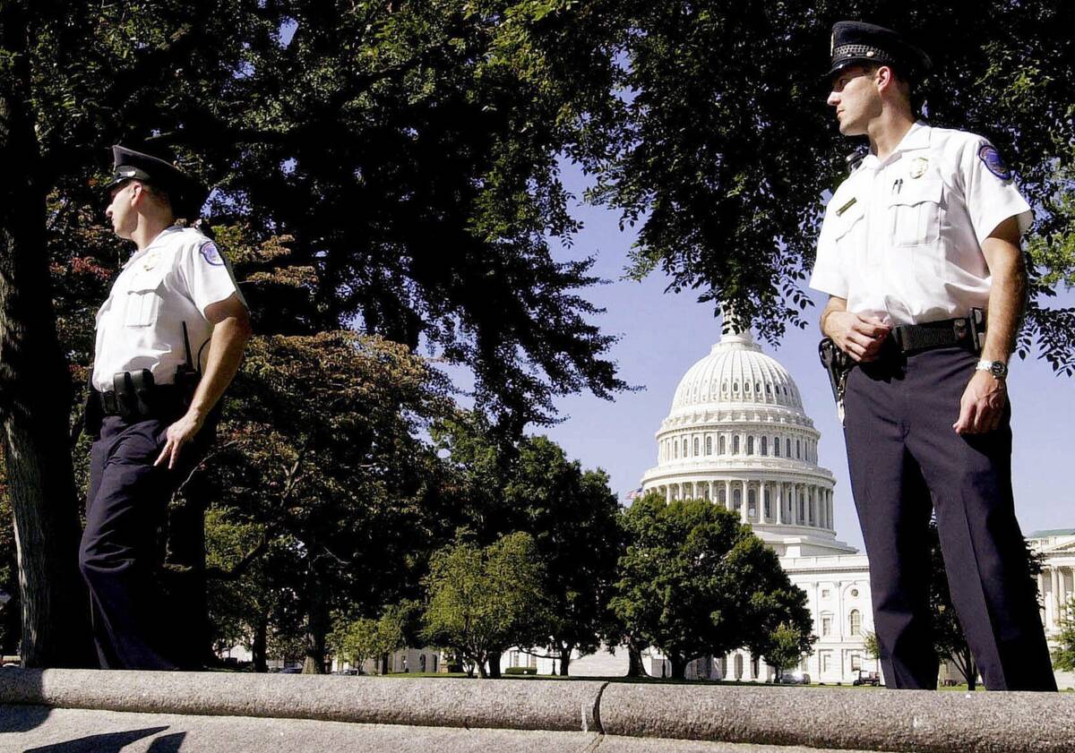 Capitol Hill Police officers guard the Capitol in Washington after it was evacuated, and a peri ...