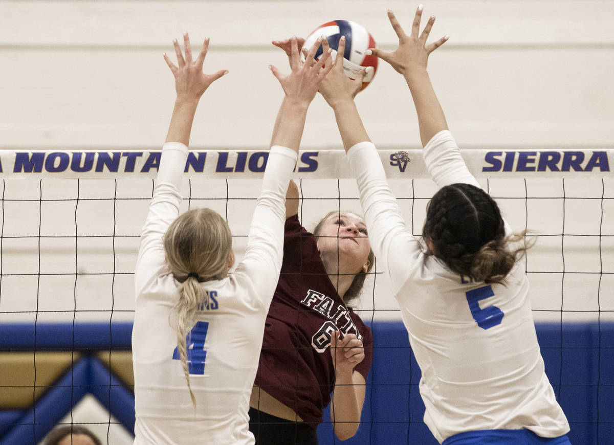 Faith Lutheran’s Bianca Richardson (6) has her shot contested by Sierra Vista’s M ...