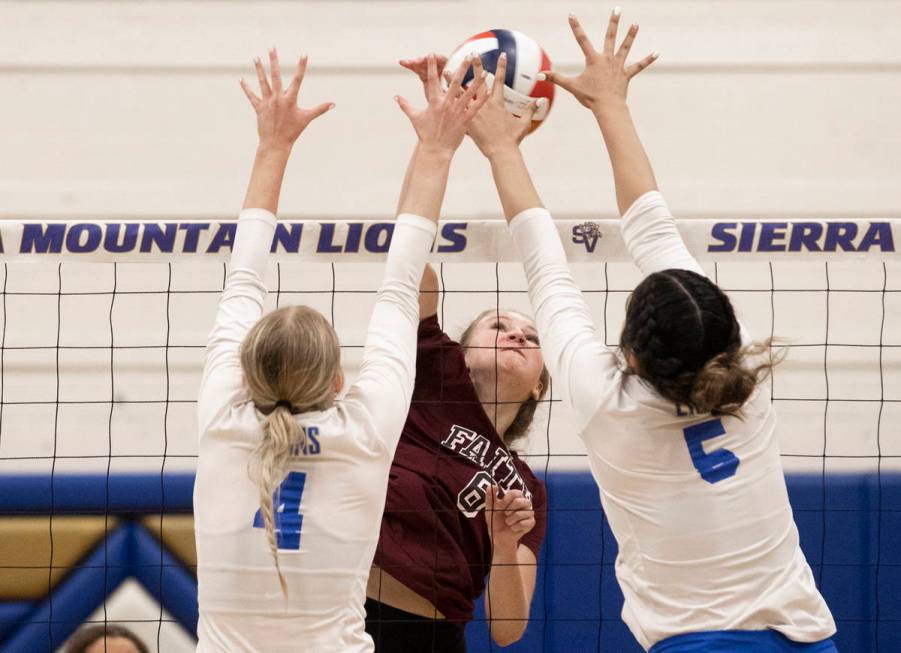 Faith Lutheran’s Bianca Richardson (6) has her shot contested by Sierra Vista’s M ...