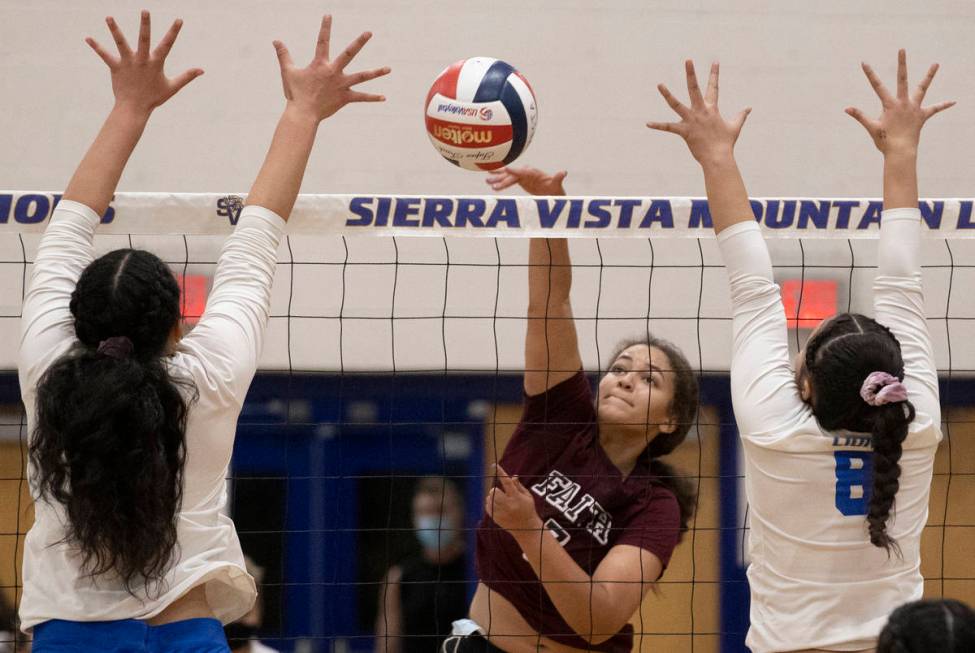 Faith Lutheran’s Kayleigh Kennedy (7) has her shot contested by Sierra Vista’s Ju ...