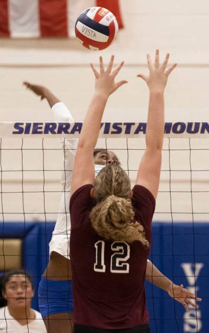 Sierra Vista’s Sumanpreet Kaur (18) leaps over Faith Lutheran’s Delaney Wilson (1 ...