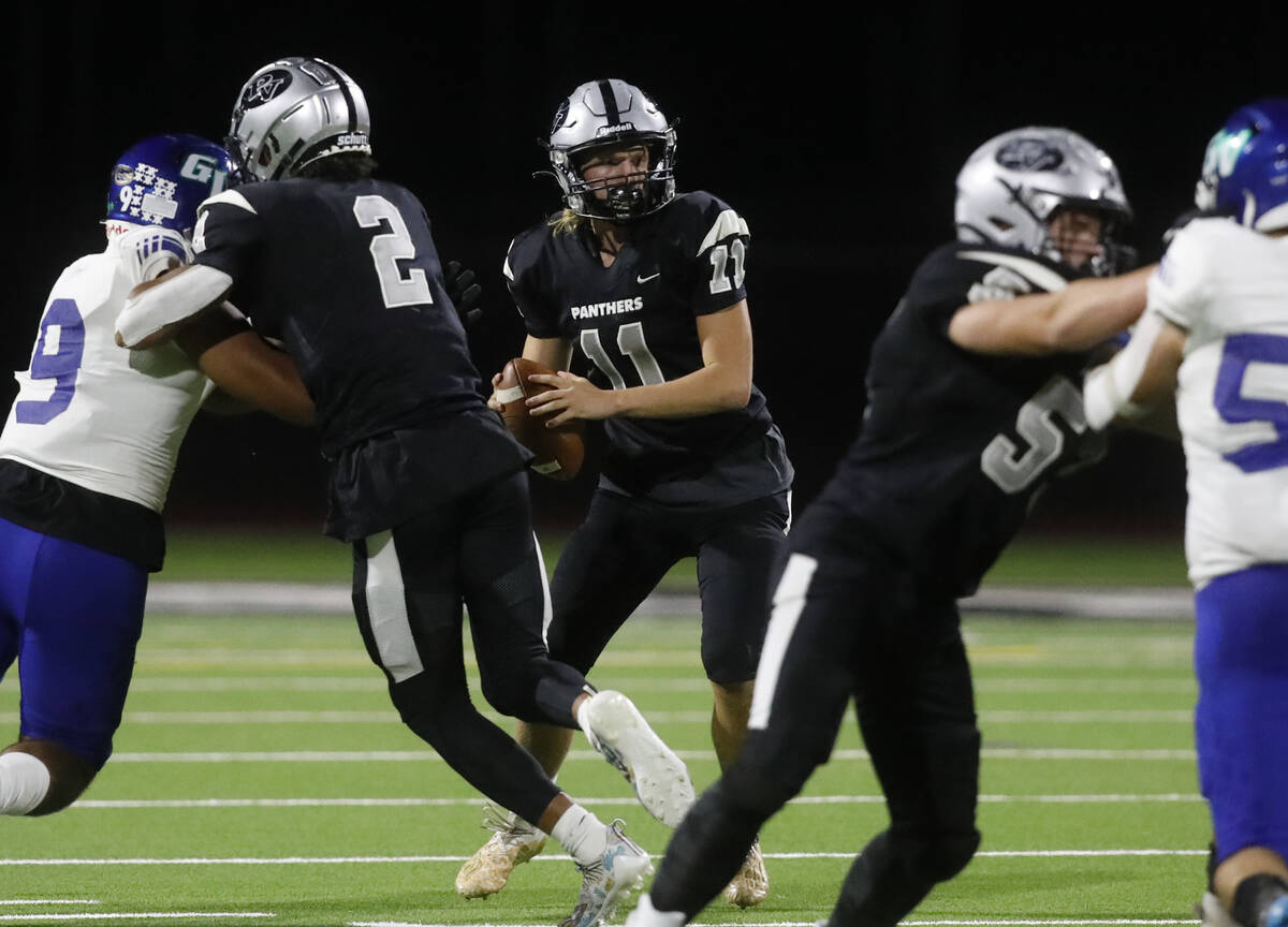 Palo Verde High School's quterback Brady DeNardin (11) looks to throw the ball against Green Va ...