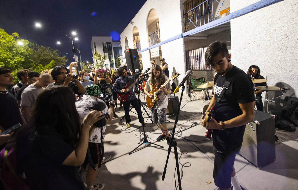 People watch as Ugly Boy, a band from east Las Vegas, performs during First Friday in the Arts ...
