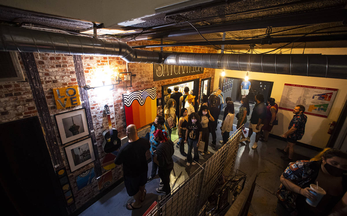 People explore the Arts Factory during First Friday in the Arts District of downtown Las Vegas ...