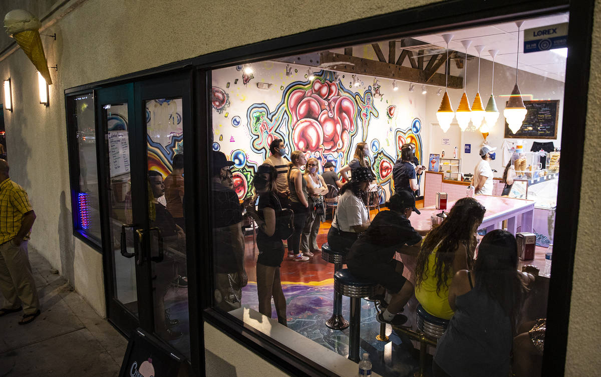 People line up for sweet treats at Cream Me Ice Creamery during First Friday in the Arts Distri ...
