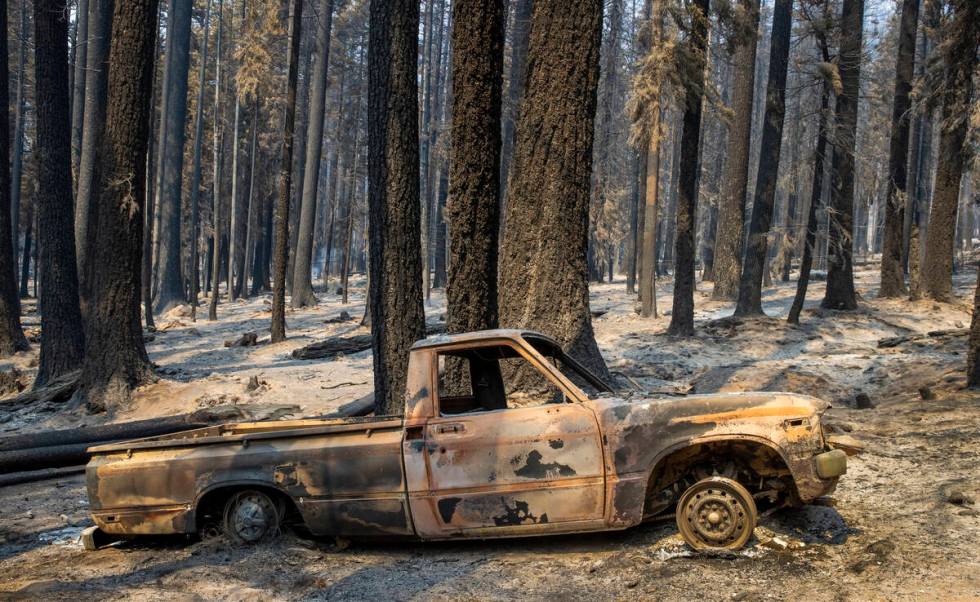 A burned-out pickup truck from the Caldor Fire on Thursday, Sept. 2, 2021, in Twin Bridges, Cal ...