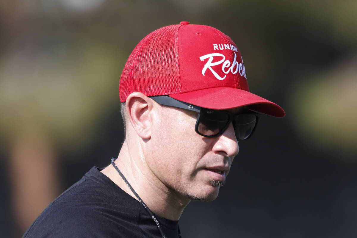 UNLV Rebels head coach Marcus Arroyo watches his players during football practice in UNLV, Wedn ...