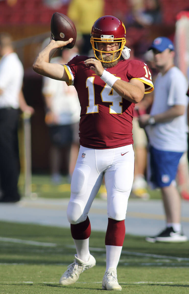 Washington Football Team quarterback Ryan Fitzpatrick (14) makes a throw before an NFL preseaso ...