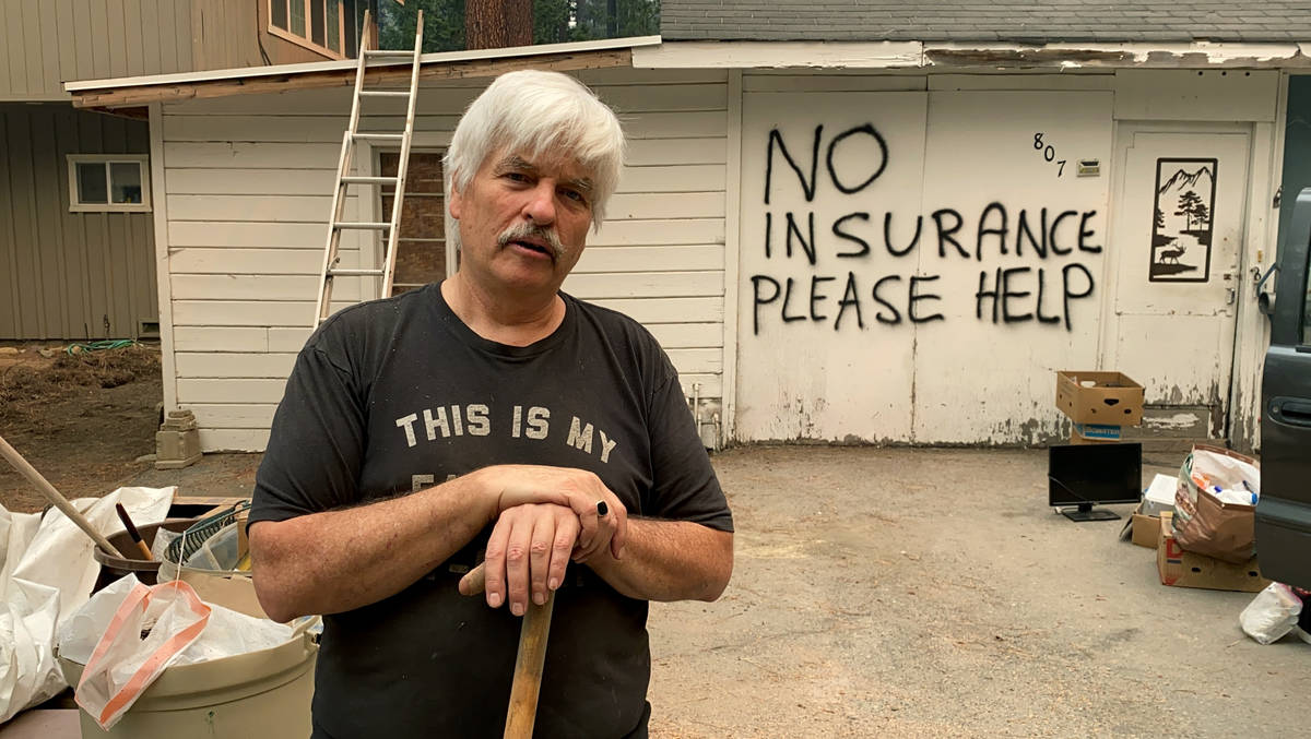Tod Johnson stands in front of his house in South Lake Tahoe, Calif., on Tuesday, Aug. 31, 2021 ...
